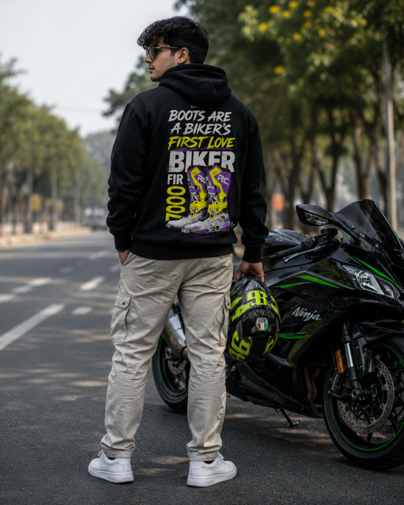 Black biker hoodie featuring the “Boots Are Biker First Love” graphic design, styled for motorcycle riders and streetwear fashion